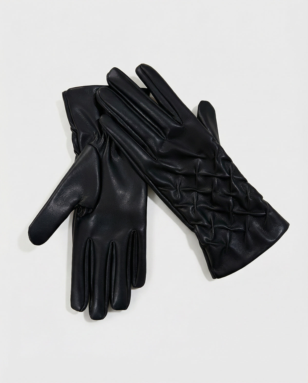 Glove black in smooth, soft-touch faux leather, with an elasticated shirred detail at the wrist. A fitted cut that slims the hand., 24cm long, 9.5cm wide