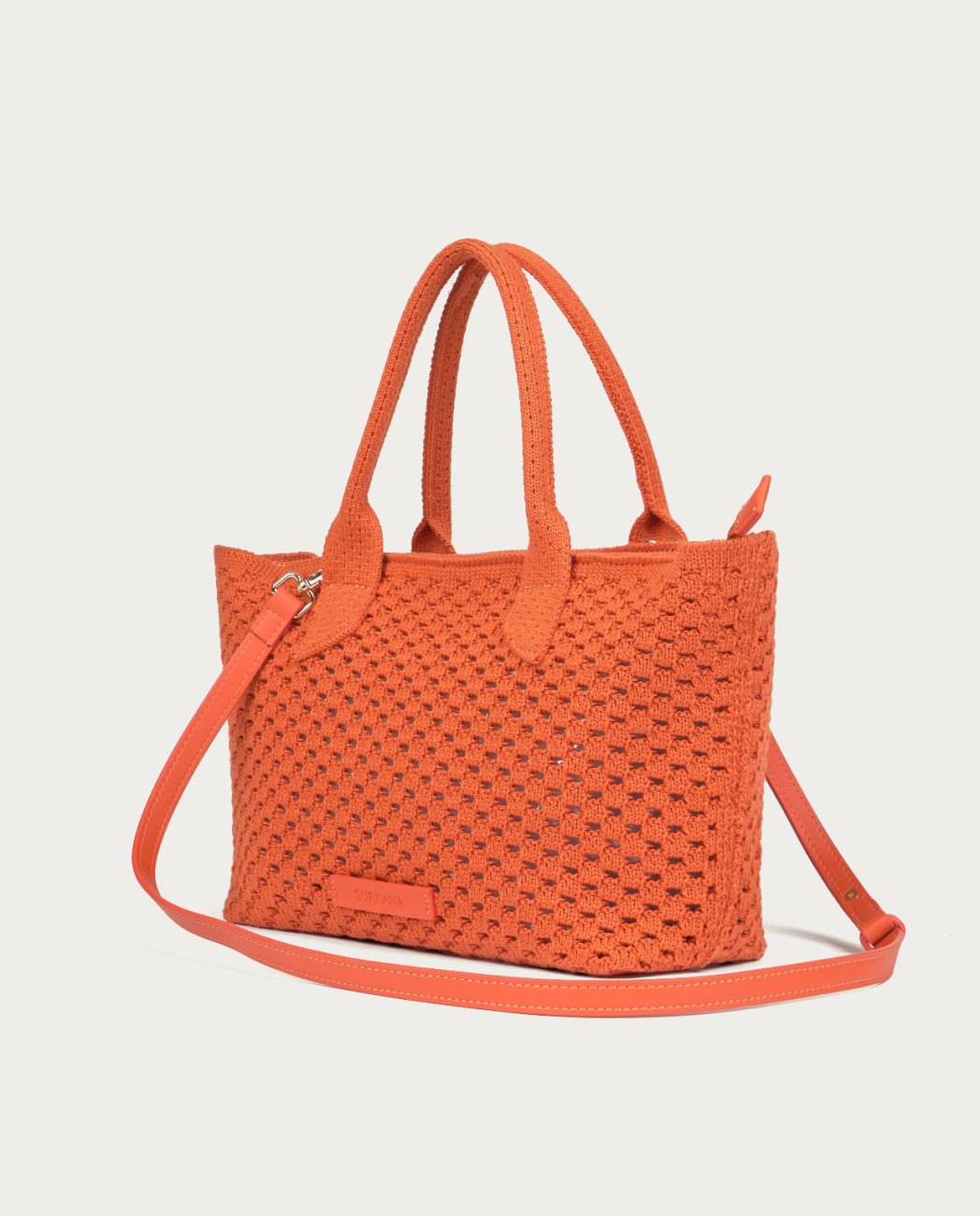 Dark Orange shopper bag made of openwork knit fabric. Wide design with top handle, adjustable - removable strap and flexible structure. Zip closure.