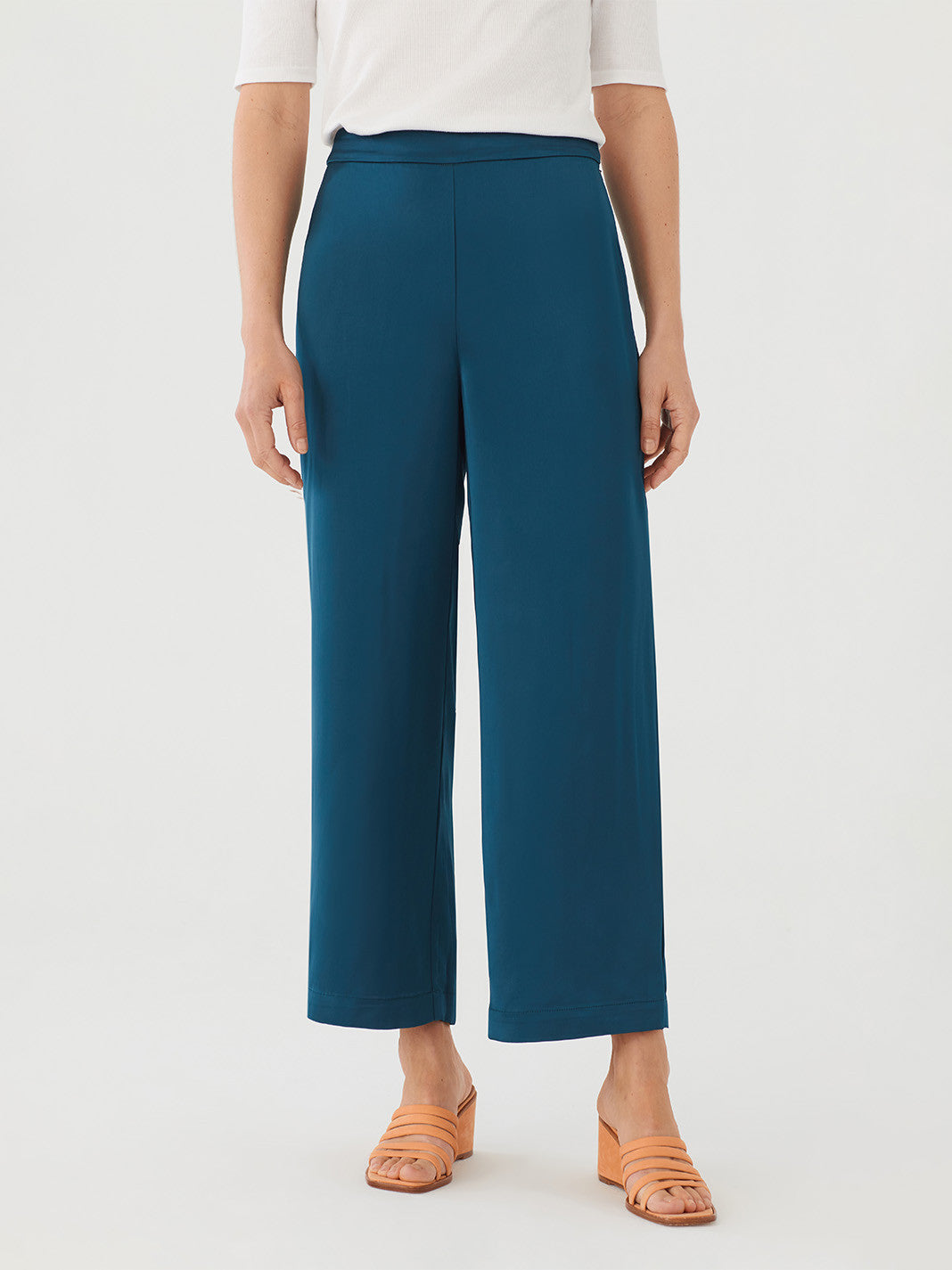 Loose, satin feel, green - blue pants. Flat front with side zip. Elastic at back. Wide Leg. Composition: 100% Viscose