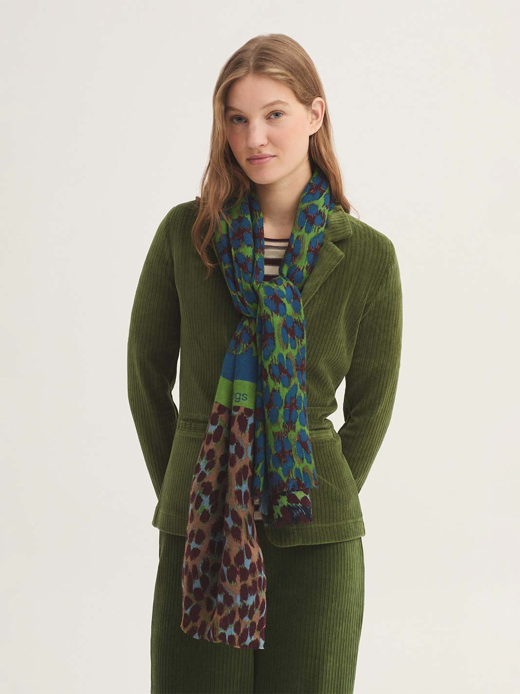Rectangular wool scarf with patch leopard print  in royal blue, light green, burgundy colors, and 2 green ad blue stripes
