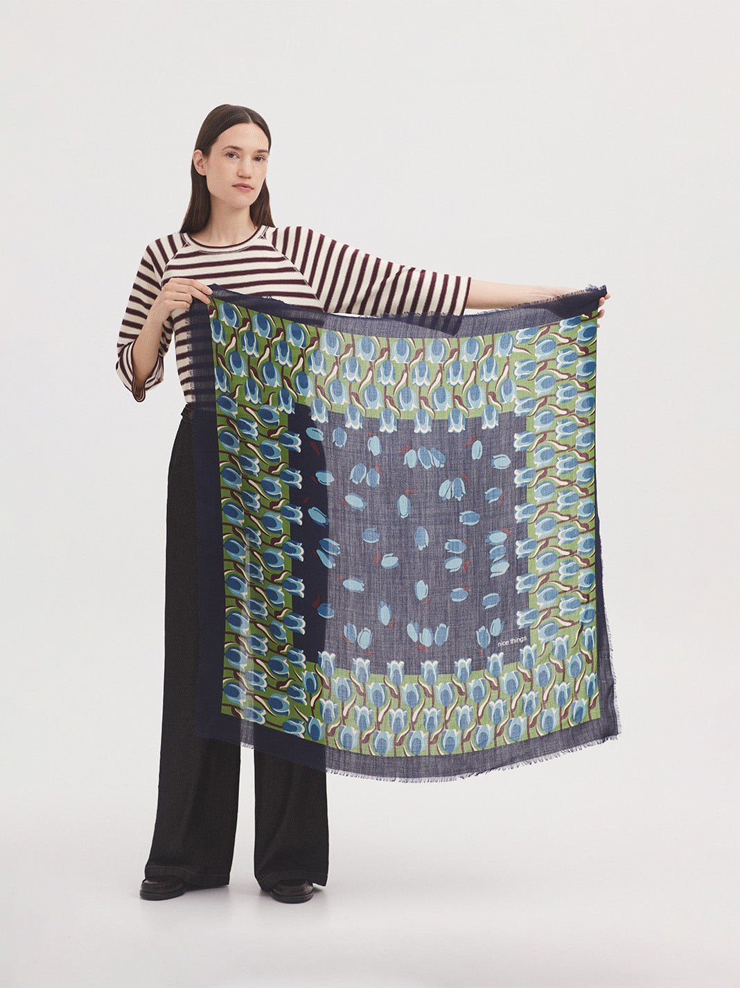Square wool scarf with garden tulips print in light green, light blue ecru and chestnut colors, in navy blue background
