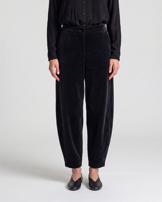 Cotton velvet black trousers with a rounded barrel leg and a high waist. Button-and-zip fastening, pockets and a soft, warm feel.