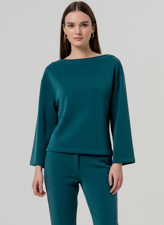 Boxy fit petrol modal-knit top with a boat neck and wide flared sleeves. Soft, fluid fabric with a light drape and pleasant feel. Plain and easy-going, comfy and flattering for a relaxed look.