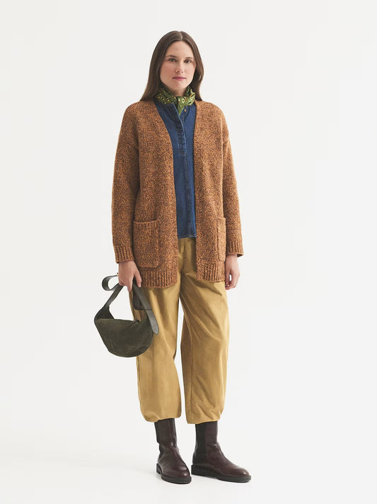 Open front ochre mottled cardigan in wool and recycled polyester blend with front pockets and long sleeves. Ribbed finish.