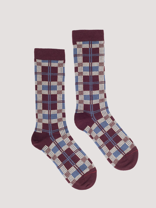 Pair of plaid patterned socks with chestnut, light blue and ecru colors 
