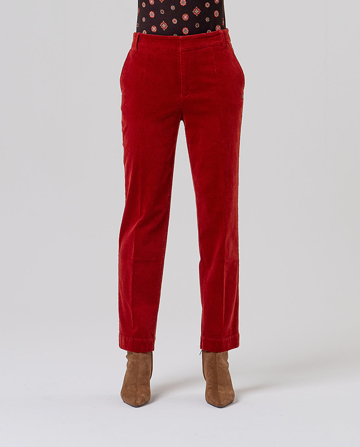 Straight-leg red chino trousers with mid rise, belt loops and pockets. Fine cotton corduroy, soft with a ribbed texture. Plain, with a clean, flattering drape. Comfort.