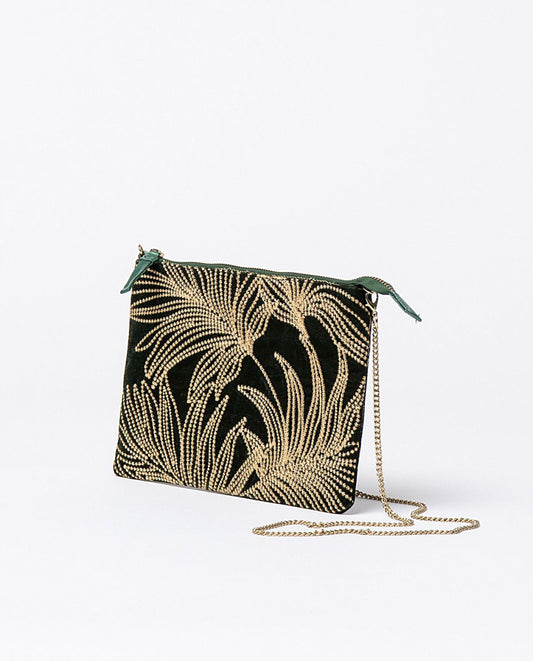 Velvet dark green clutch with contrast embroidery. Includes removable metal chain handle to carry crossbody. It closes with a zipper and has an interior compartment. Lining.
