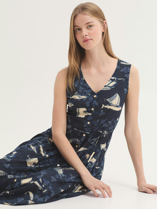 Midsummer Books print midi dress, with books, fishes, leaves,birds, objects prints, in navy background color, V neck and button front, ruffle skirt, self-fabric belt,50%Viscose,50% Cotton.