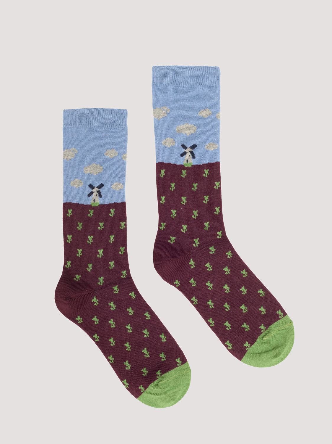 Pair of socks with a pattern of dutch landscape in light blue, chestnut and light green colors