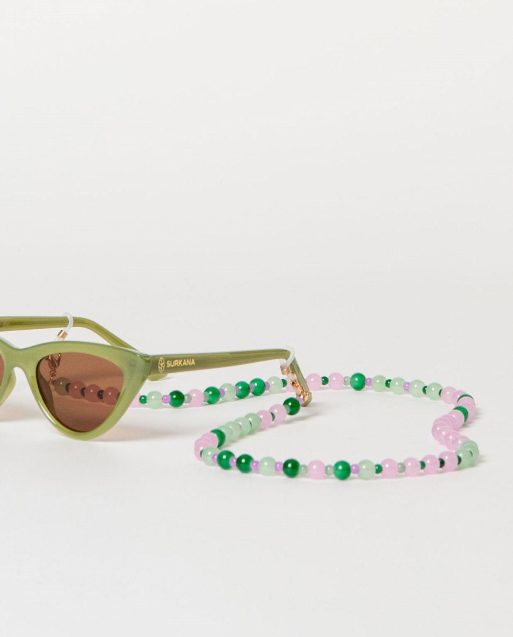 Beaded eyeglass cord in green and pink colors.