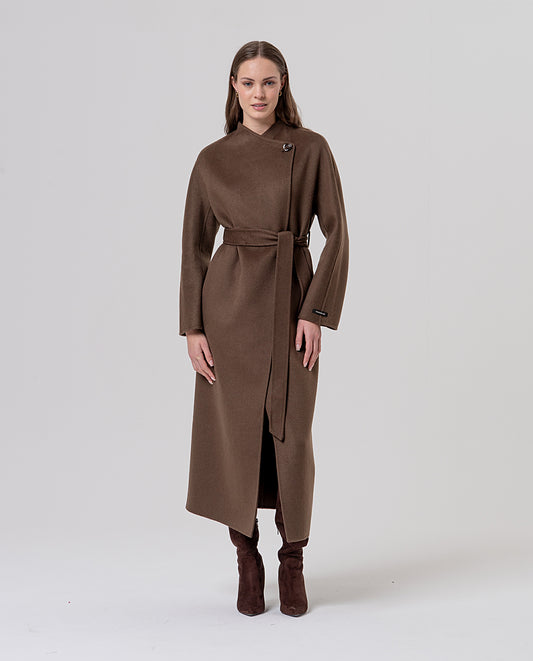 Long dark camel double-breasted wool coat with an asymmetric wrap collar and a belt to define the waist. Decorative button fastening and side pockets