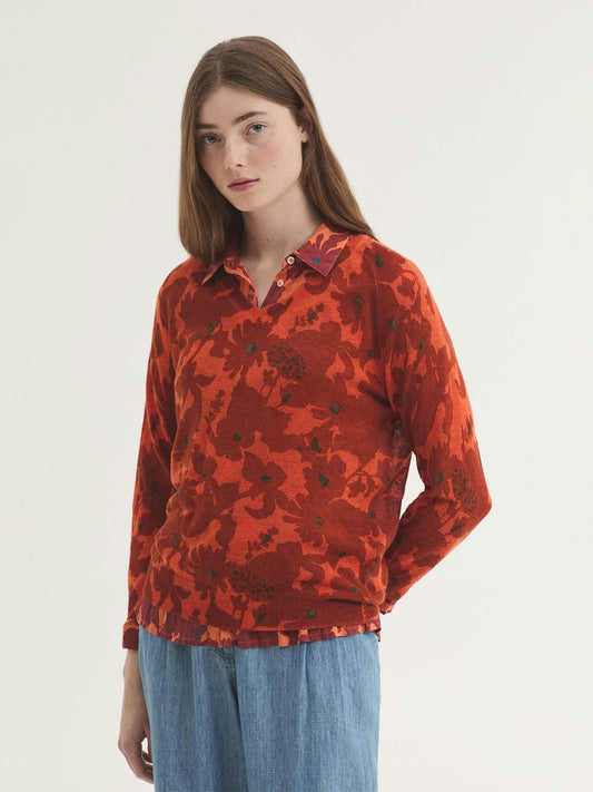 Penelope Flowers in intense terracotta color with green dots in orange background color print jumper,V neck, long raglan sleeves and ribbed finish.