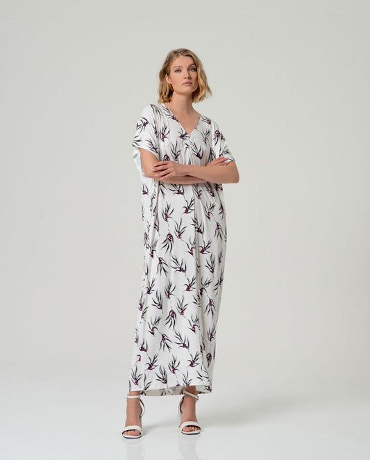 Long white kaftan style dress with floral print. 