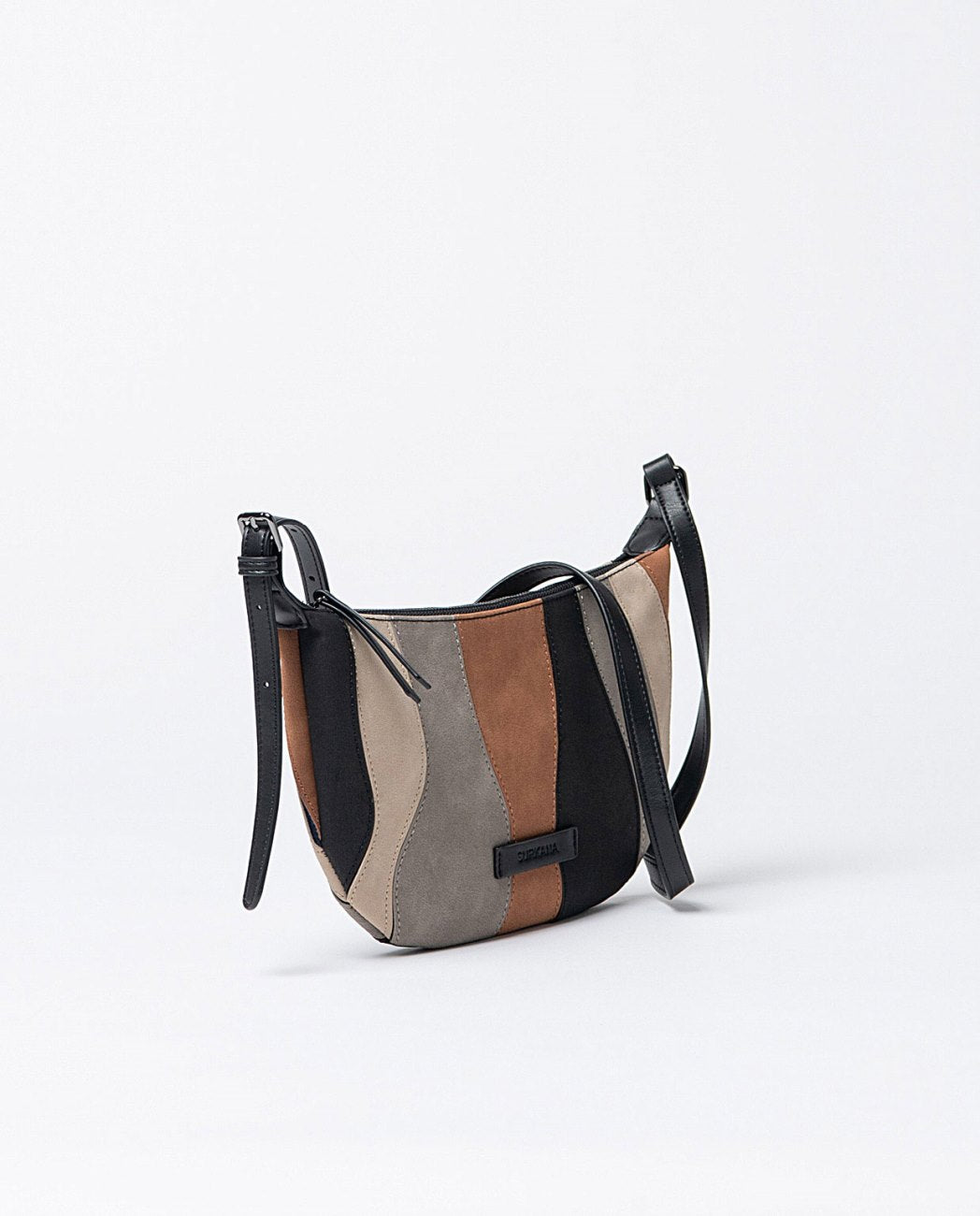 Curved leather crossbody bag with adjustable shoulder strap. Colorful pieces of leather stitched together, in black, grey camel, ecru colors, 1 open pocket inside. Lining.