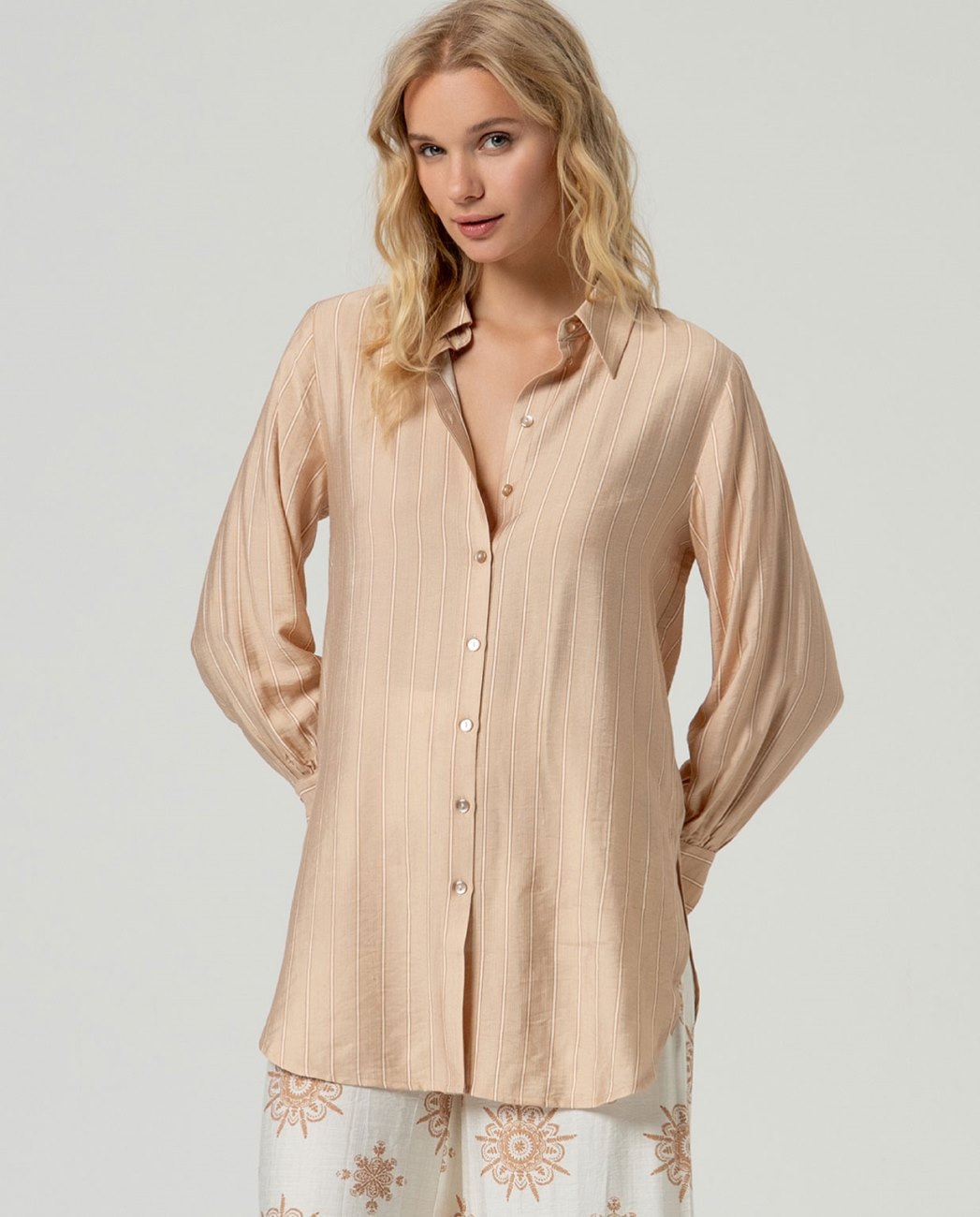 Beige button-up stripped viscose shirt.