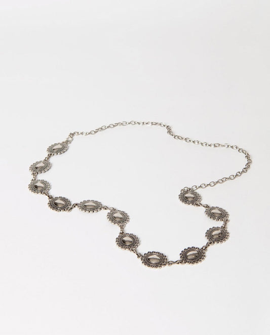 Silver belt with floral designs.