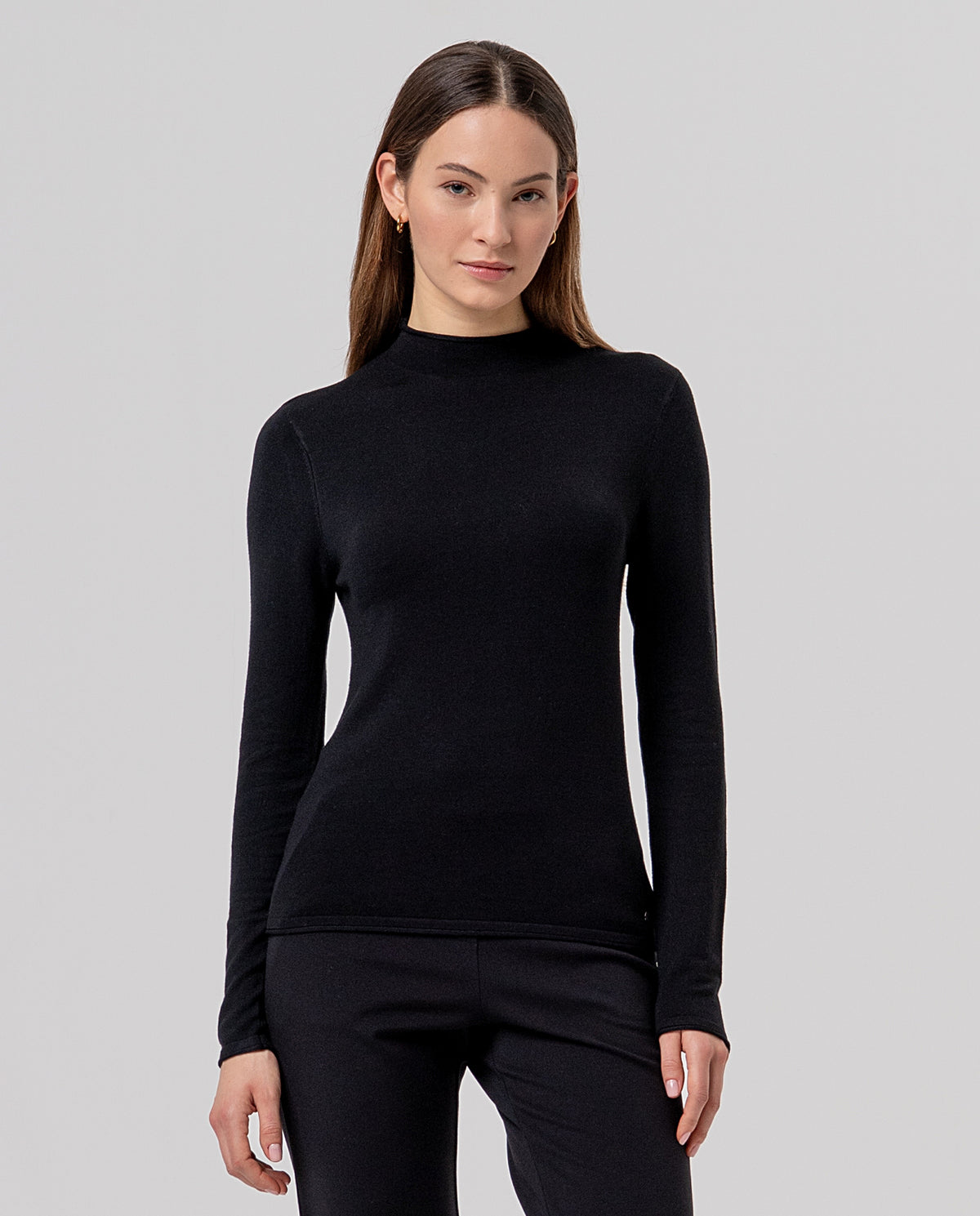 Black mock-neck, long-sleeve jumper in fine viscose knit, soft and light to the touch. A fitted, flattering shape that looks great.
