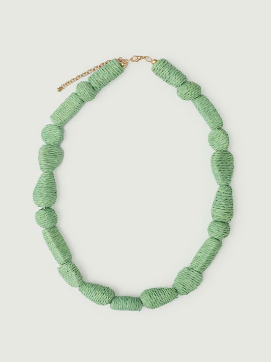 Geometric beads necklace made of raffia, mint color, adjustable bronze closure, 26 cm in length.