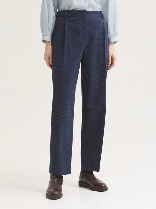 Trousers blue in houndstooth brushed cotton fabric. Featuring concealed metal hook, button and zip fastening at front, front slash pockets and back piped pockets, aside from belt loops and loops with buttons at the waist.