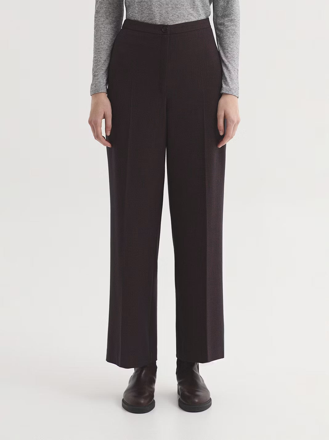 Mottled chestnut  trousers in recycled stretch polyester blend fabric. Featuring zip and button fastening at front. Wide leg.
