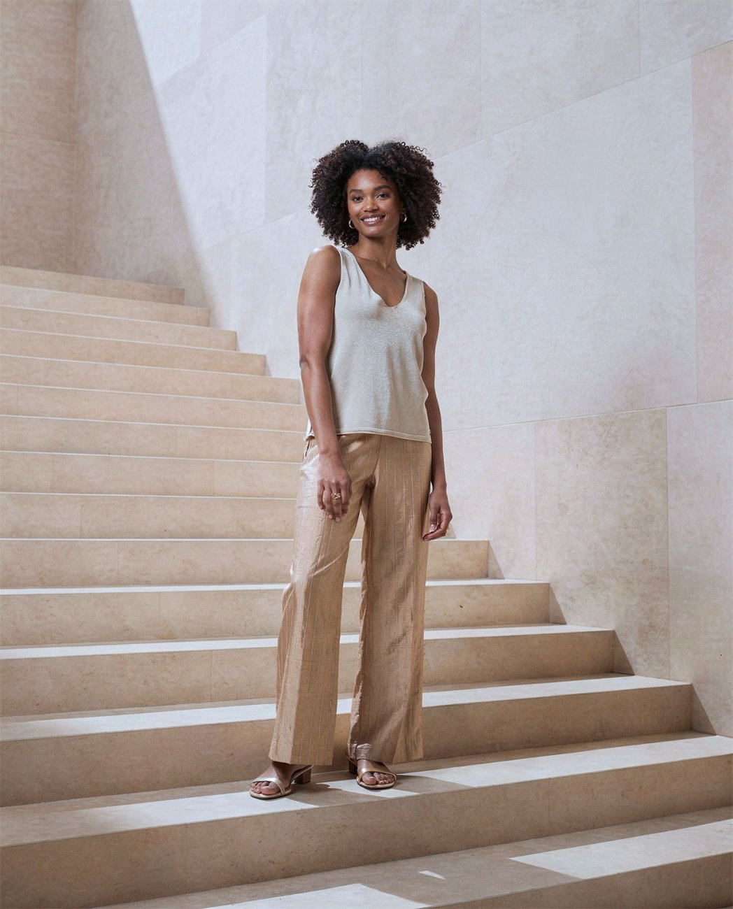 Stripe beige pants with elastic waist.