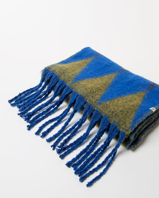Soft, warm scarf with a harlequin-style geometric diamond print in blue, navy and khaki colors and fringed ends.200cm long, 42cm wide