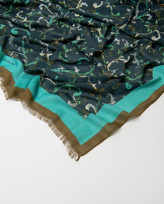 Rectangular dark green scarf in light viscose with fluid drape. Abstract arabesque print in white, menta and taupe colors, with a contrasting banded border and fringe.