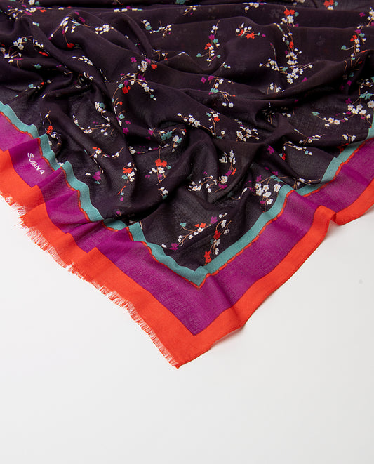 Rectangular purple scarf in light viscose with fluid drape. Delicate ditsy floral print of scattered sprigs in menta, fuchsia, orange and white colors, with a bright banded border and fringed trim.
