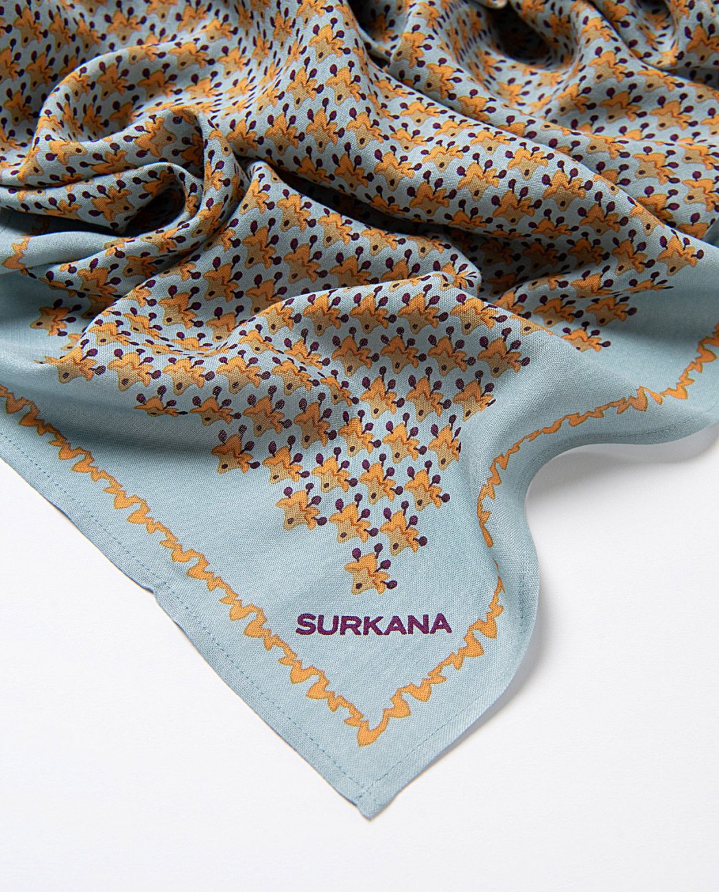 Rectangular little flowers printed scarf made of viscose twill, in light blue orange, brown colors