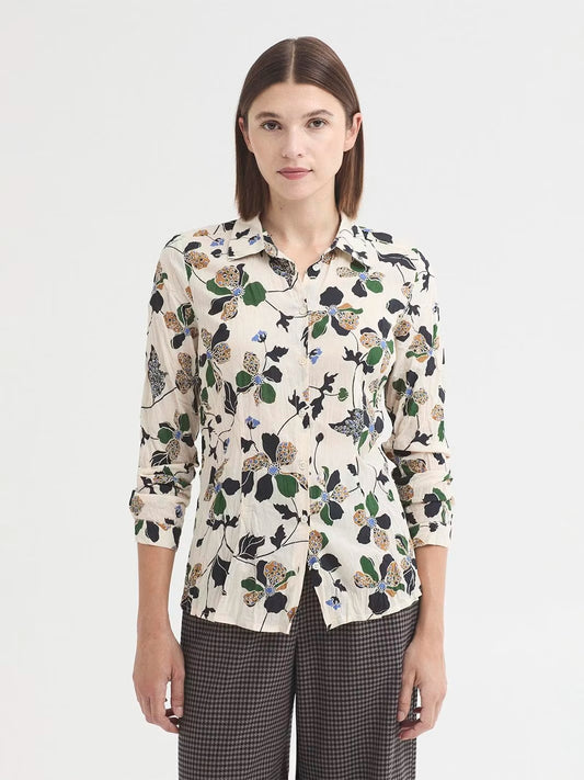 Shirt ecru with Geometric Flowers print in sustainable crinkle cotton fabric. Shirt collar and mother-of-pearl button front. Long sleeves with vent, cuff and button. Complete with matching fabric bag.