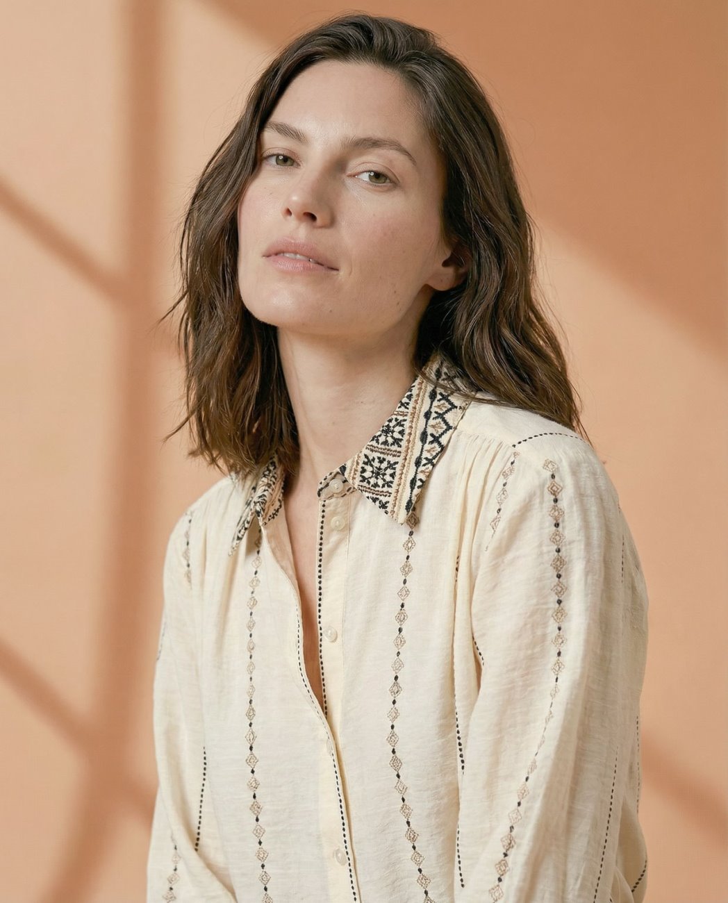 Ecru embroidered print black viscose shirt.