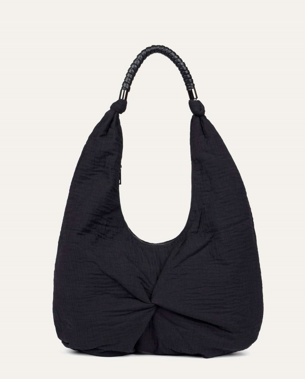 Shoulder black fabric bag with a crinkled finish. It includes a top handle with wraparound detail and decorative metal piece.