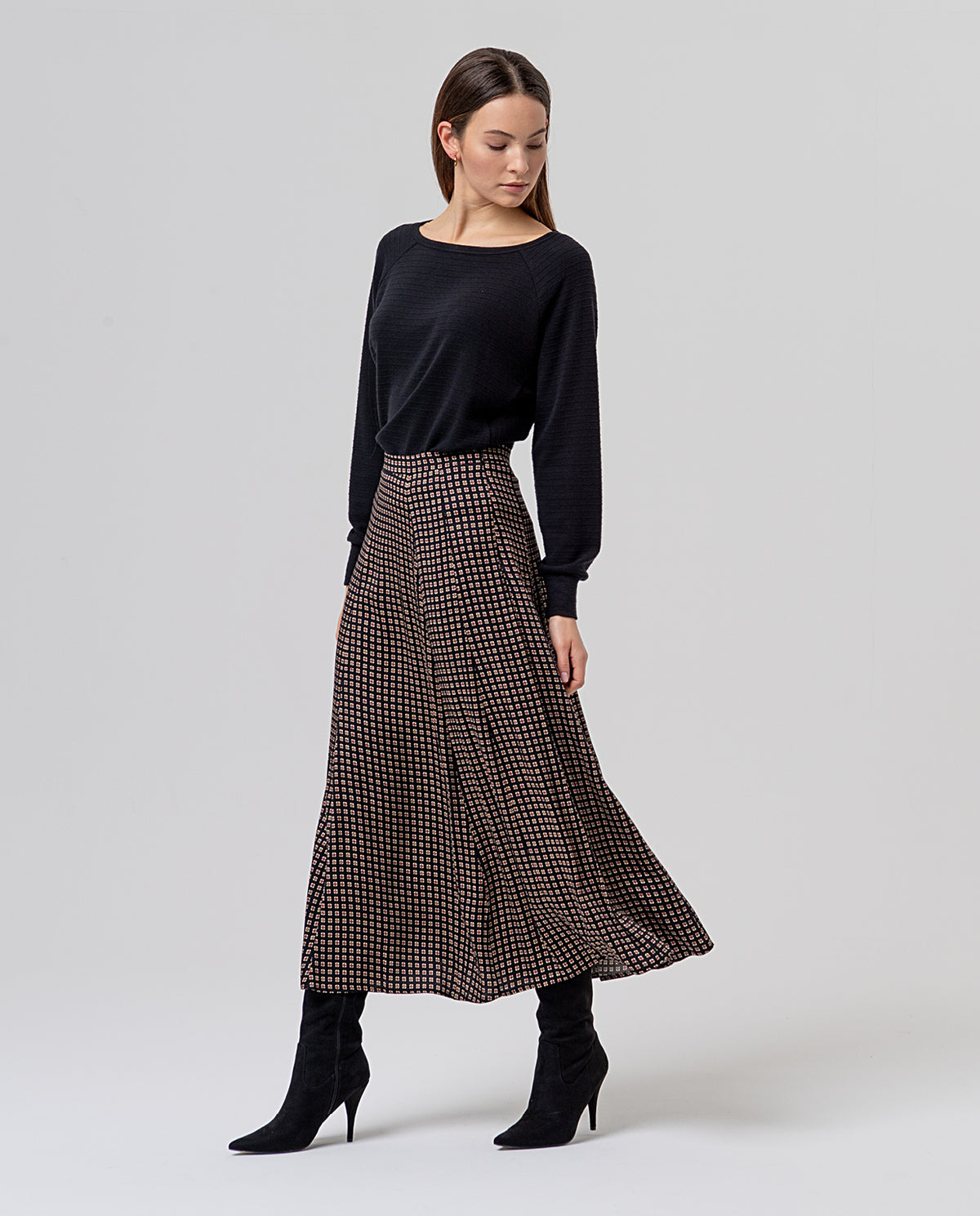 Black flared midi skirt with a fluid viscose drape,smooth waist and an A-line silhouette, feminine and comfy. Small geometric foulard-style print, multicolour
