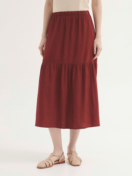 Ruffle intense terracotta skirt in viscose and nylon cheesecloth, with concealed elasticated waist, side pockets and split hem.