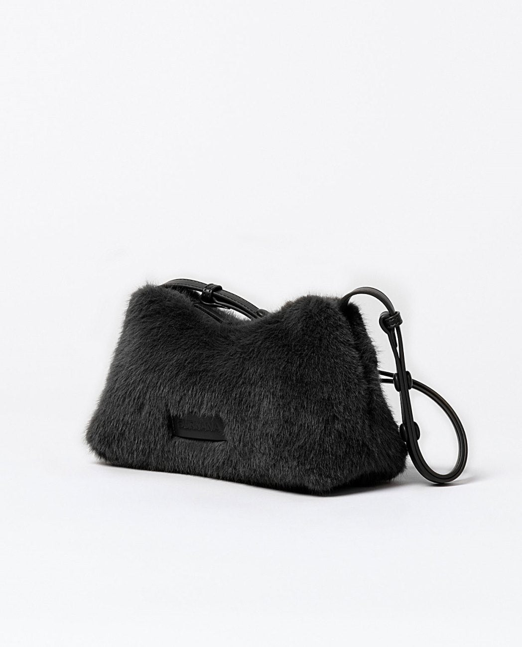 Baguette shoulder faux fur black bag with a multi-position adjustable handle with press studs, top zipper closure, one inner open pocket. Lining.