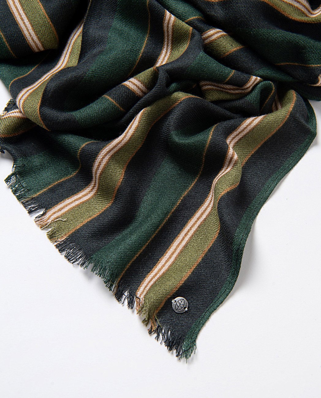Stripes printed scarf made of a soft wool and viscose blend, in dark green, navy blue olive and beige colors, with mini bangs for a delicate and elegant finish.