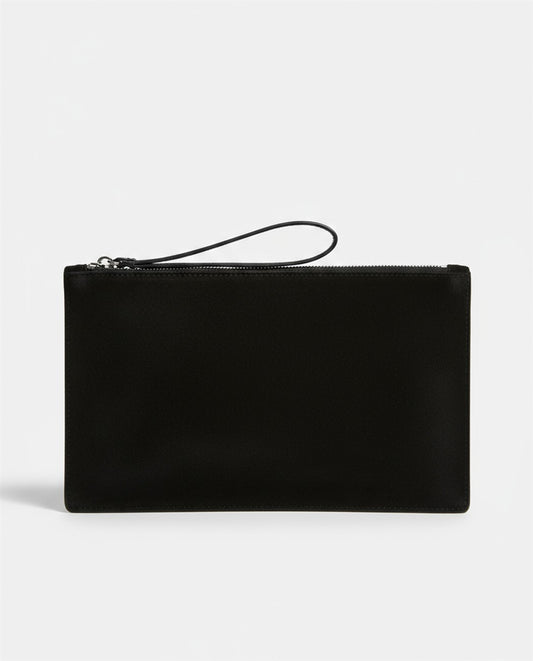 Flat black clutch in soft suede effect, with a zip closure and wrist strap. Card pockets. 14cm x 9,5cm x 1cm