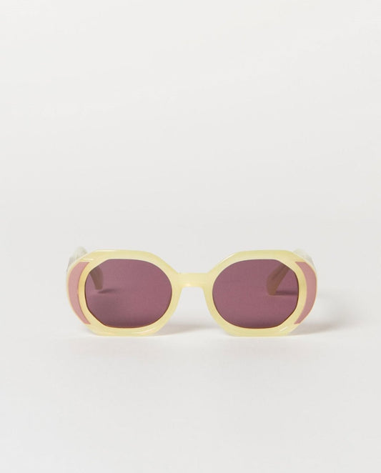 Sunglasses with an ecru frame and purple lenses.