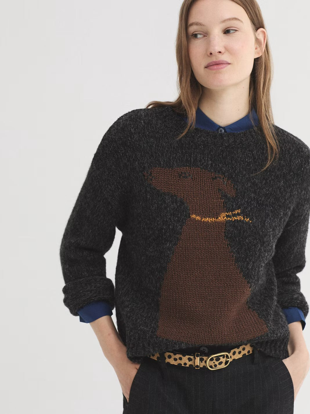 Mottled dark grey jumper in wool and recycled polyester blend with brown dog intarsia knit at front, round neck and long sleeves. Ribbed finish.