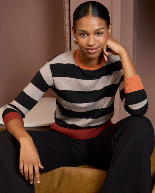 Knitted sweater with round neck and wide black and grey stripes, red and orange finish at the bottom and sleeves,  28%Polyester 24%Acrylic 22%Nylon 26%Viscose