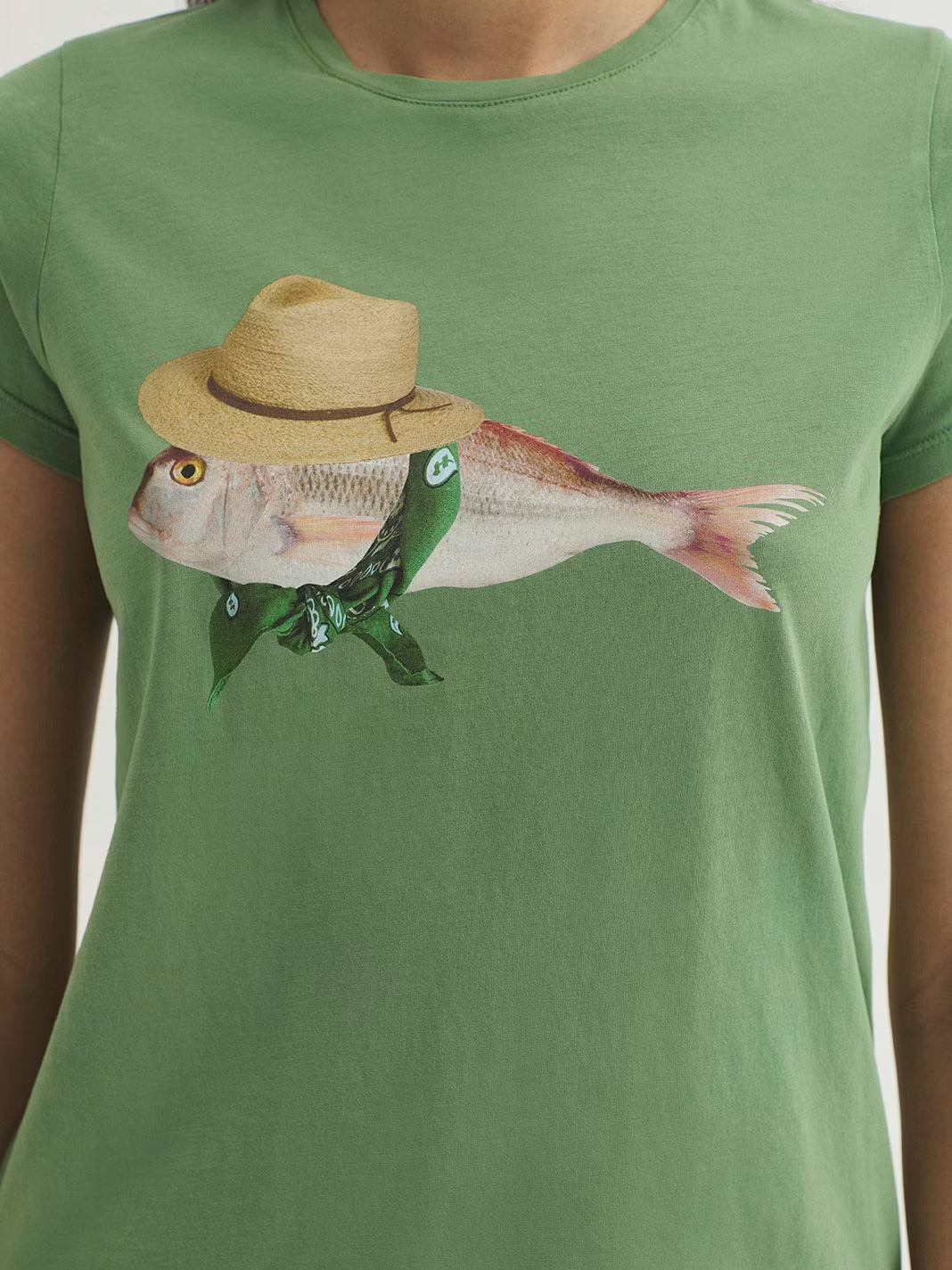 Mint  cotton T-shirt, with a fish print wearing a hat and a green bandana, round neck and short sleeves.