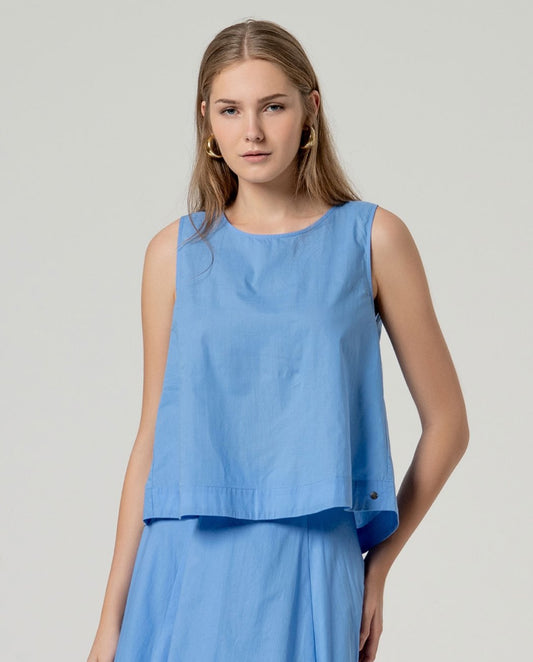 Light blue sleeveless round neck cotton top.