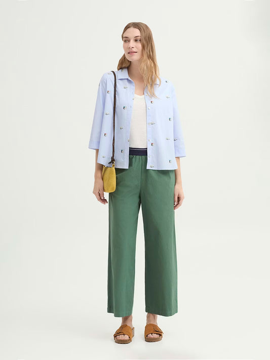 Smoke Green Trousers made of overdyed sustainable cotton poplin. Featuring a contrast elasticated waistband, side pockets and a wide leg design.