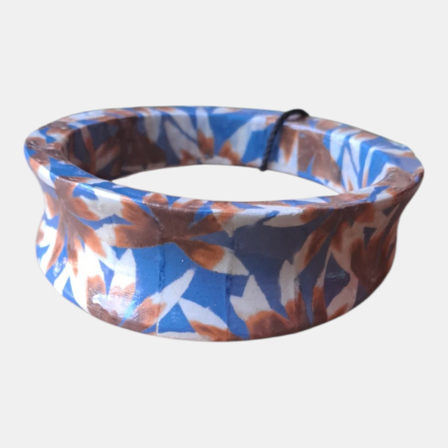 Wooden flower print bracelet, from 80% wood, 10% paper, 5% lacquer, 5% printer ink, measurements: 2 - 3cm wide, 7,5cm diam.