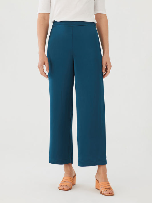 Loose, satin feel, green - blue pants. Flat front with side zip. Elastic at back. Wide Leg.  Composition: 100% Viscose