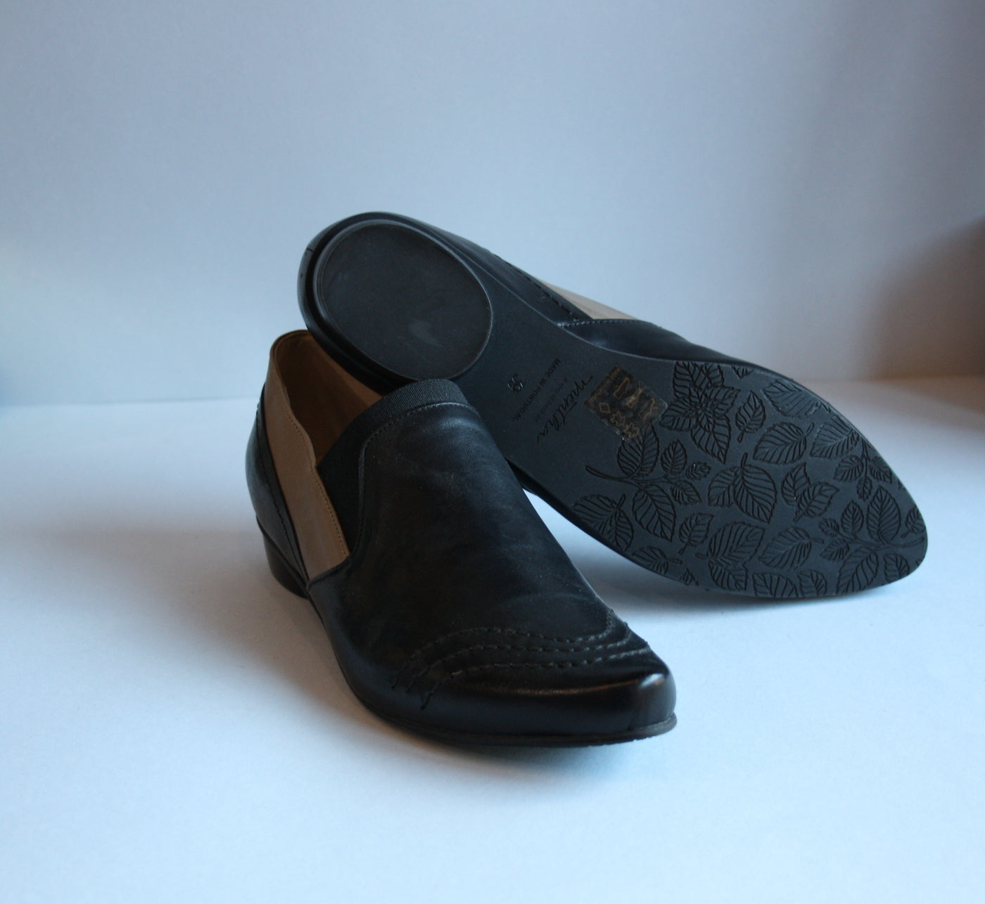 Loafer style black flat shoes