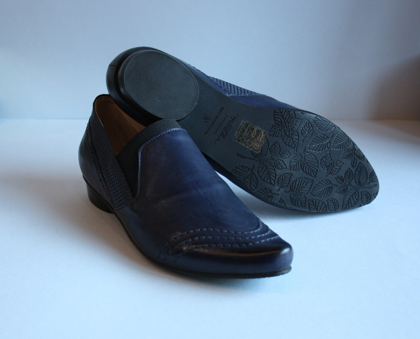 Loafer style blue flat shoes